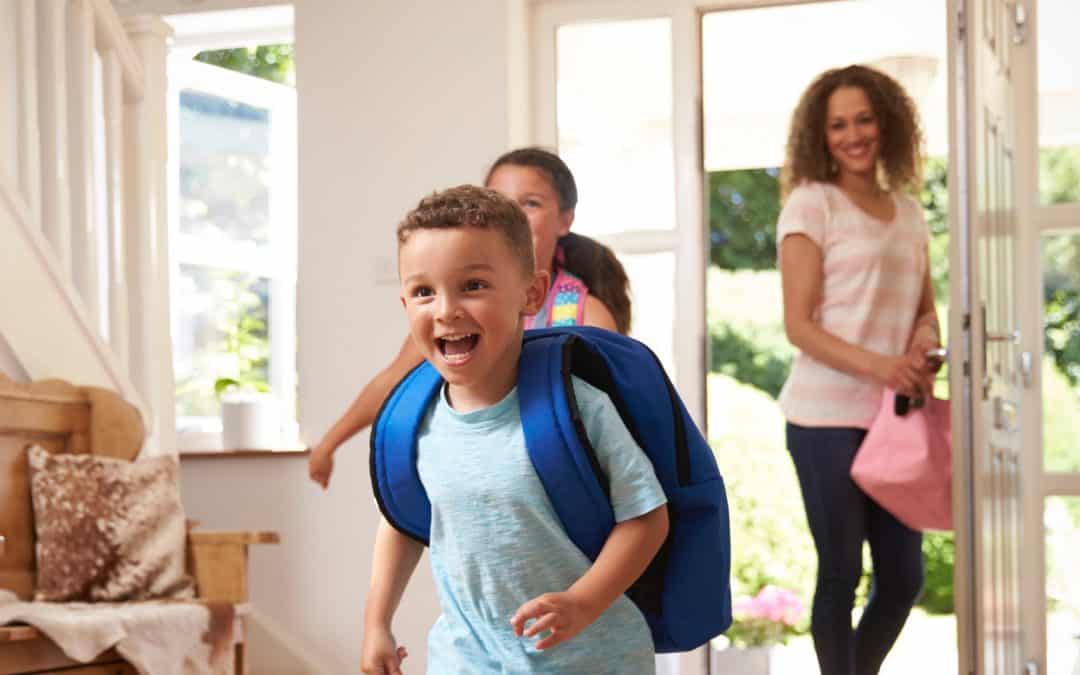Excited Children Returning Home From School With Mother
